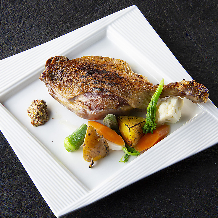 Duck leg meat confit with seasonal vegetables